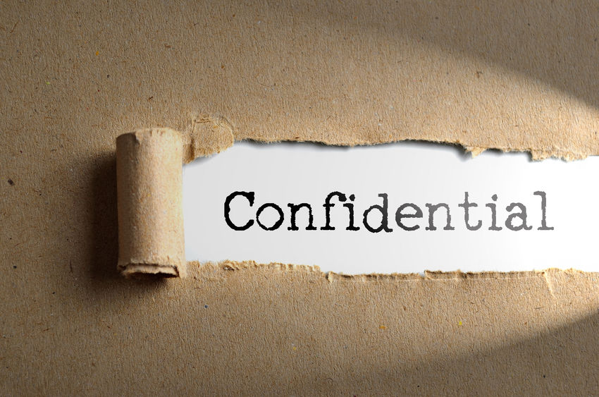 Torn paper with word Confidential | Confidential document disposal 
