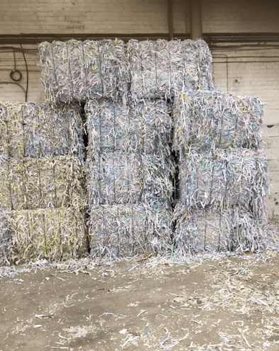 Image of shredded paper baled up into blocks | confidential waste disposal