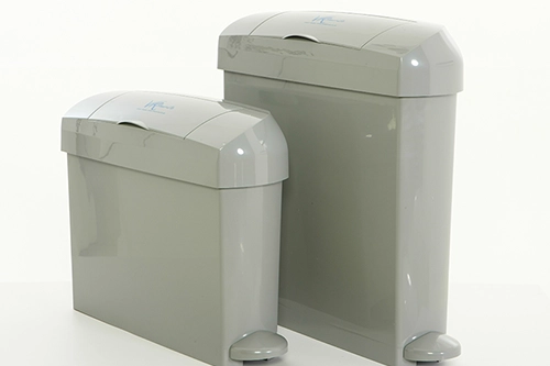Image of two grey feminine hygiene sanitary waste collection  bins with foot pedals