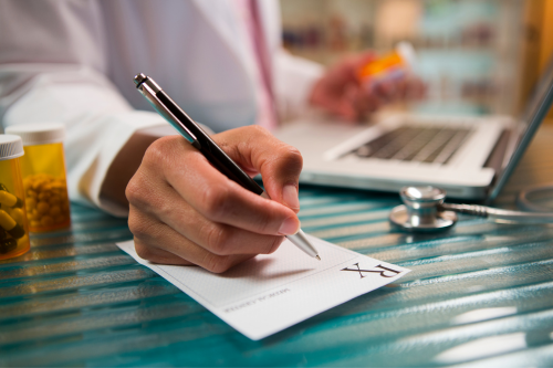 Image of a pharmacist writing a prescription | Confidential Waste in the Healthcare industry